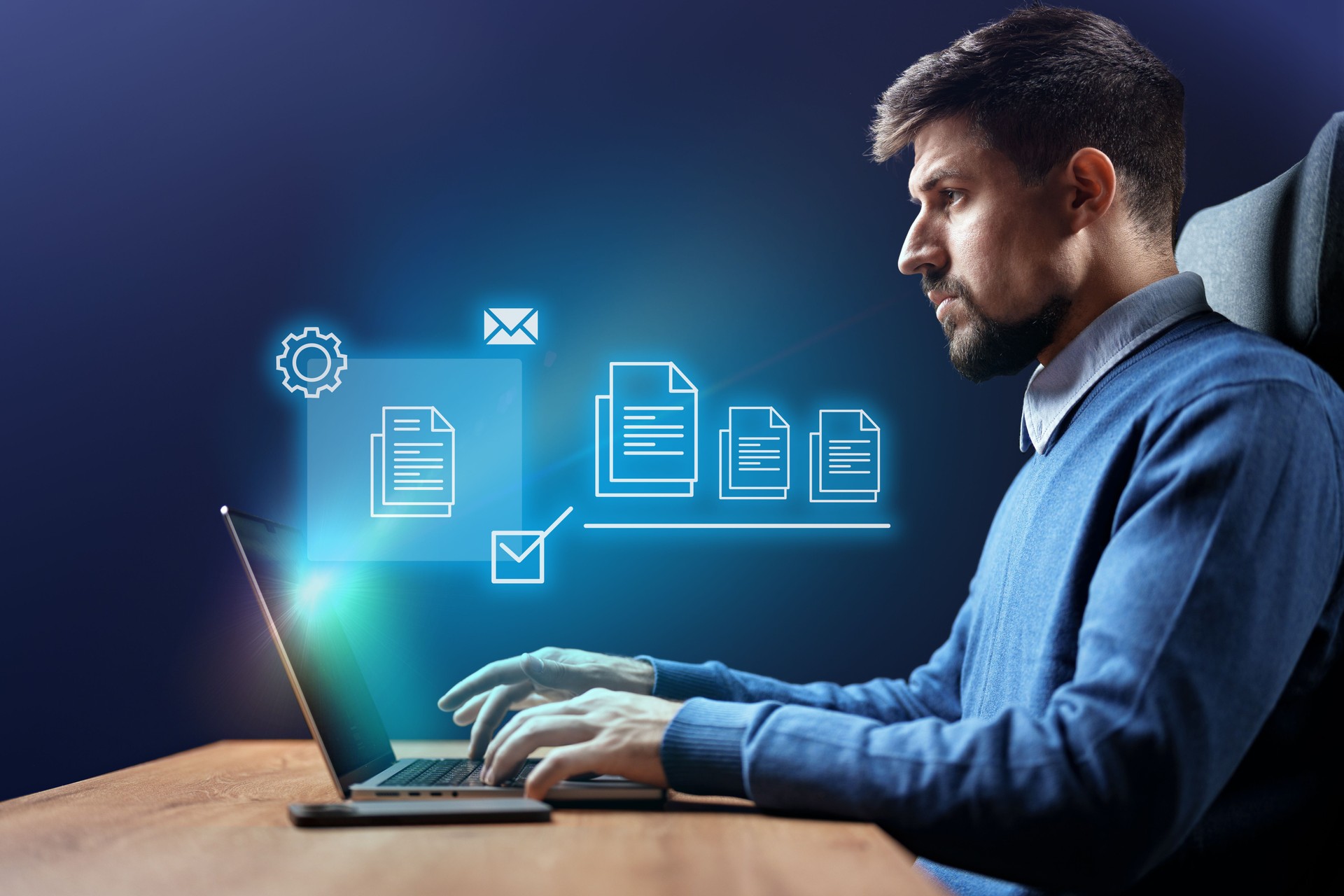 Young professional working on a laptop in a modern office displaying digital icons related to productivity and efficiency